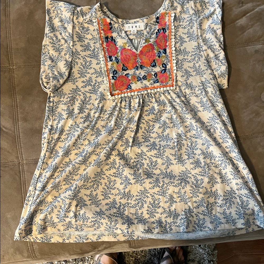 Floral blouse with embroidery.